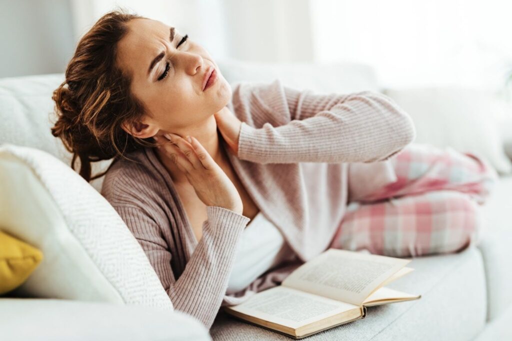 woman struggling with common perimenopause symptoms