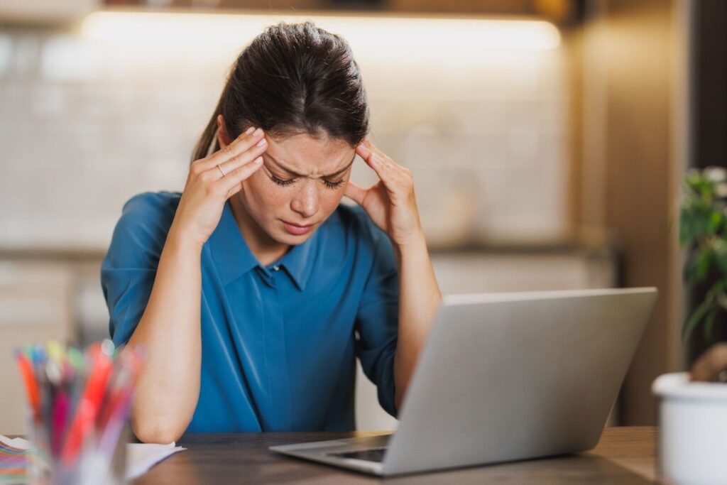 woman struggling with common perimenopause symptoms